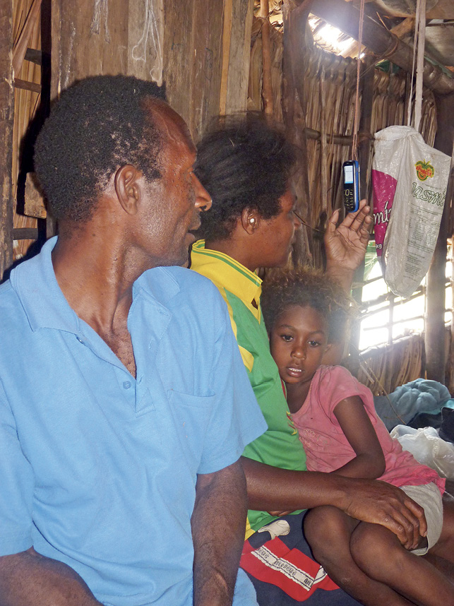 Figure 6: A mobile phone hanging by a doorway in Darapap village